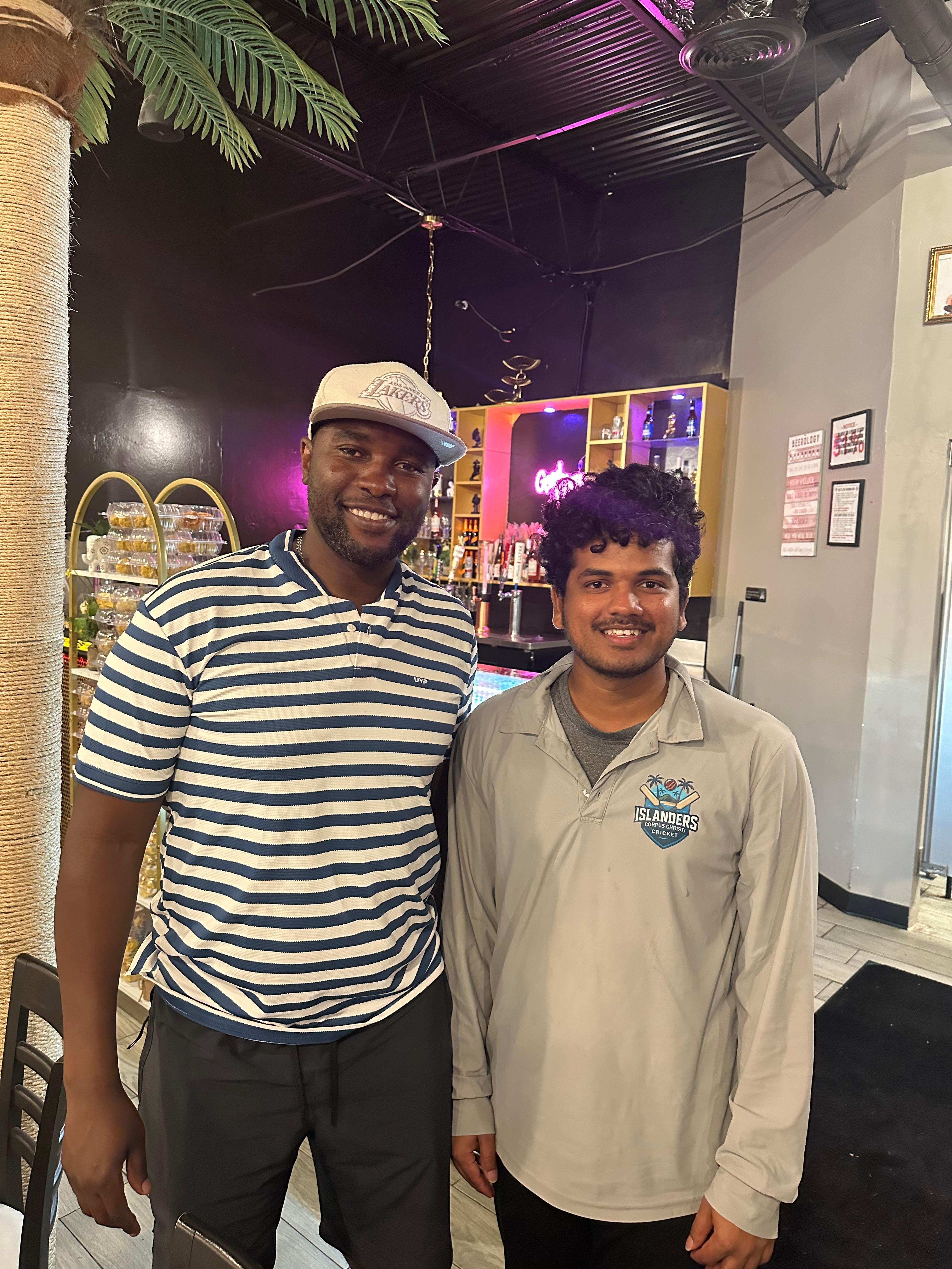 Sampath Reddy receiving coaching tips from Elton Chigumbura